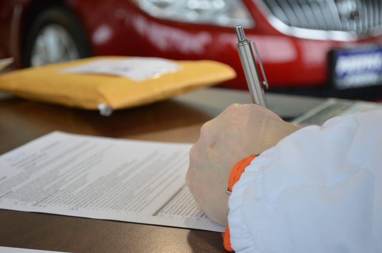 someone signing a contract for a property investment